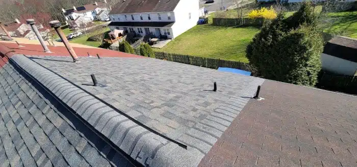 A close-up view of a newly installed ridge vent system, an essential detail for understanding how to know when roof was replaced through modern roofing techniques.